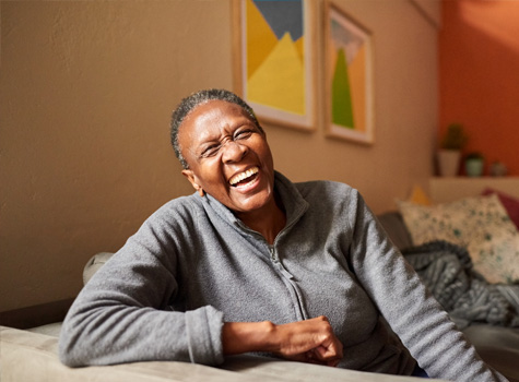 A senior woman happy because she knows where to go for care.