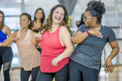 A group of women exercising, having fun, and feeling well.